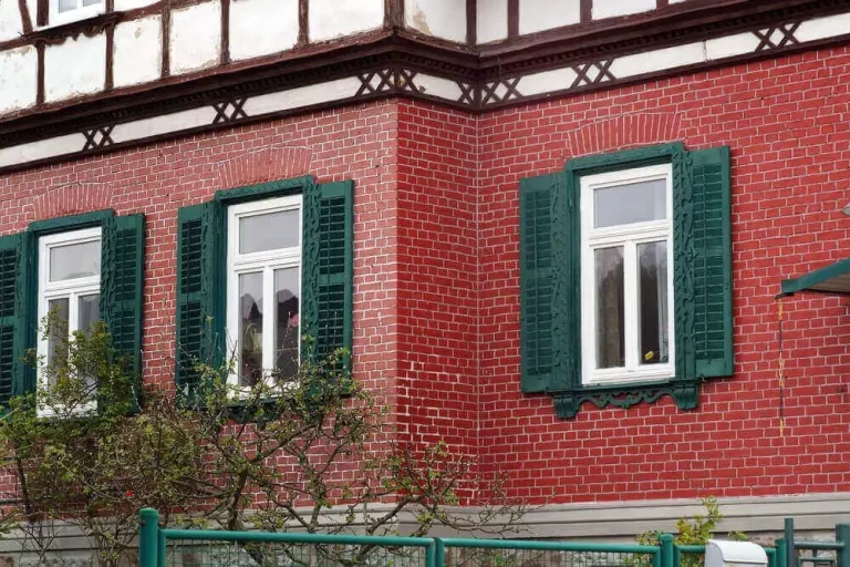 Green shutter color for red brick house